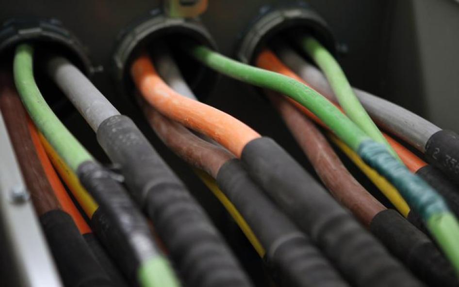 Fiber optic cables carrying internet providers are seen running into a server room at Intergate.Manhattan.