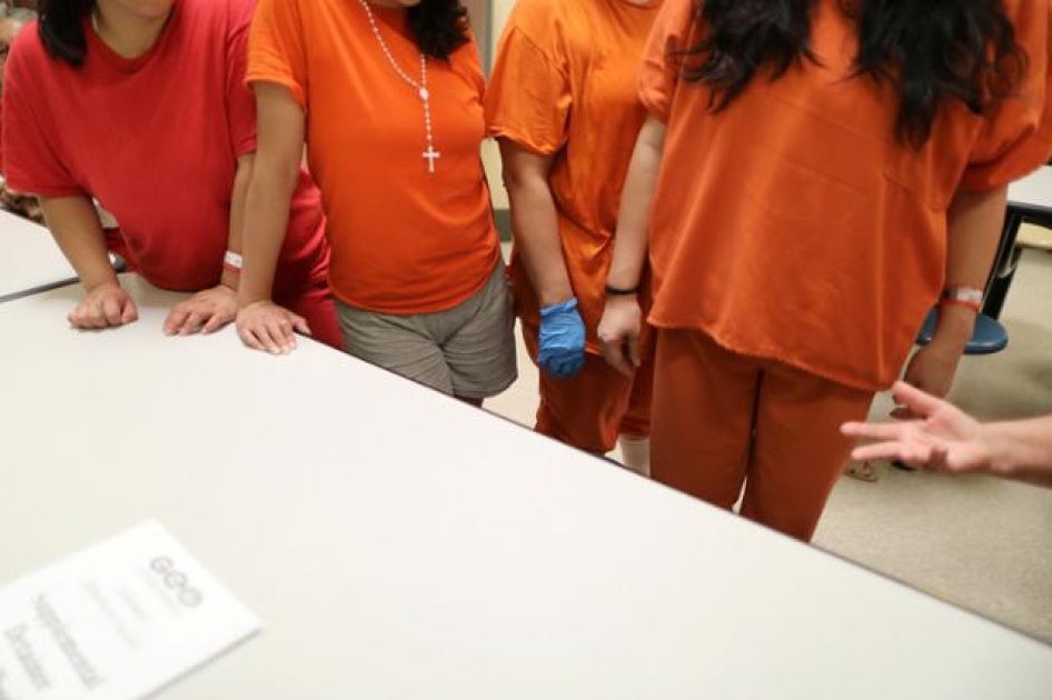 Women stand in a dormitory at the Adelanto immigration detention center, which is run by the Geo Group Inc (GEO.N), in Adelanto, California, U.S., April 13, 2017.
