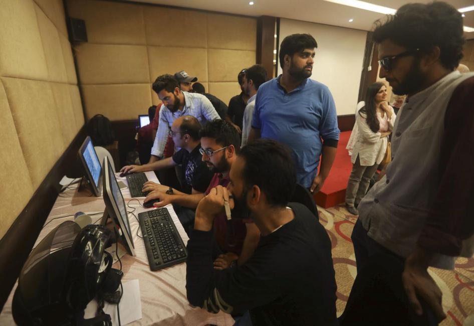 With communications shut down, journalists work inside a media center in Srinagar set up by Jammu and Kashmir authorities, August 18, 2019. 