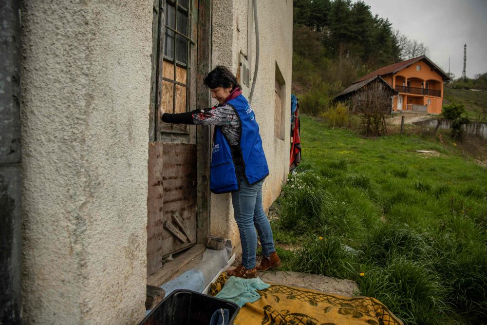 A woman enters a building