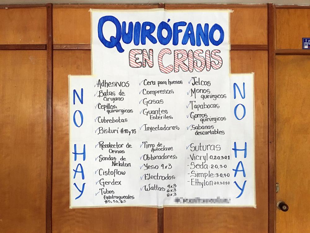In a pediatric hospital in Lara State, a hand-lettered sign lists supplies needed at an “Operating Room in Crisis,” June 2016