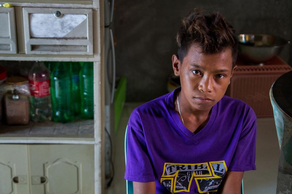 “Albert,” 16, works at an underwater mining site in the Philippines.