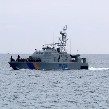 Cyprus coast guard carrying migrants from a boat from Lebanon interdicted on January 14, 2020. © 2020 Reuters/Yiannis Kourtoglou