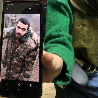 Liana Harutyunyan shows Human Rights Watch an image of her nephew Eric Khachaturyan, a prisoner of war (POW) in Azerbaijan, taken from a video in which he and other POWs are abused. Yerevan, November 2020.