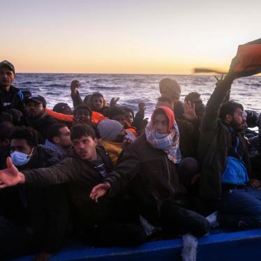 Migrants and refugees on an overcrowded rubber boat during a rescue by the Spanish NGO Open Arms in the Mediterranean Sea, Feb. 12, 2021