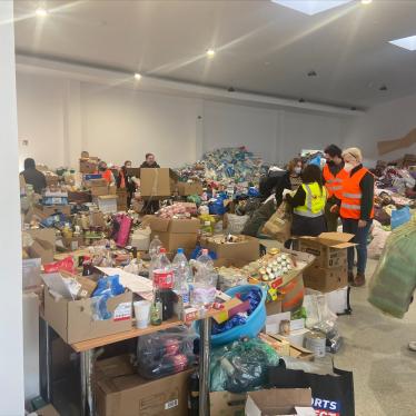 People put aid items into boxes