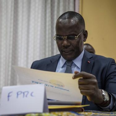 Abdoulaye Hissene, one of the leaders of the FPRC (Popular Front for the Rebirth of Central African Republic) armed group, reads a report on the breaches of the Khartoum agreements by armed groups, in Bangui, on August 23, 2019. 