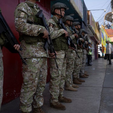 Military officers patrol a street after the government declared a state of emergency in Lima on October 22, 2025.