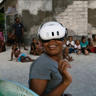 A resident of the Ngongosila community in Malaita Province, Solomon Islands views Virtual Reality content during a demo session.