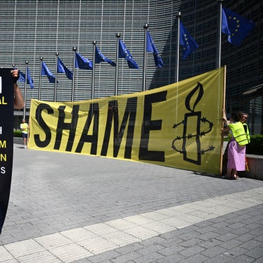 An activist at EU Commission headquarters protests against a meeting with a Taliban delegation in Brussels, Belgium, June 23, 2026.