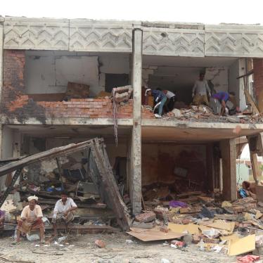 Men dig through rubble at a residential compound housing employees of the Mokha Steam Power Plant and their families that was struck by six bombs dropped by warplanes of the Saudi-led coalition, killing 57 people in Mokha, Yemen on July 24, 2015. 