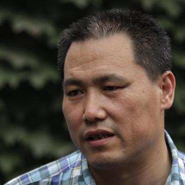 Chinese human rights lawyer Pu Zhiqiang talks to media in Beijing in this July 20, 2012 picture.