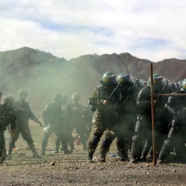 A unit from Tibet police border security force with riot gear participates in a drill at a military base in Shigatse, Tibet Autonomous Region, China, October 24, 2015.