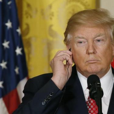 U.S. President Donald Trump holds his earpiece as he holds a joint press conference with Japanese Prime Minister Shinzo Abe (not pictured) at the White House in Washington, U.S., February 10, 2017.
