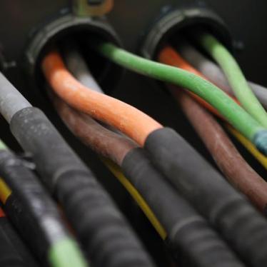 Fiber optic cables carrying internet providers are seen running into a server room at Intergate.Manhattan.