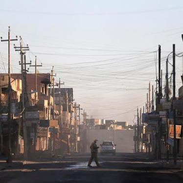 A man walks across a street in al-Hamdaniya, Iraq November 25, 2016. Picture taken November 25, 2016. © 2016 Reuters