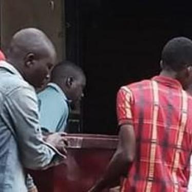 Relatives of Brian Wasswa carry his coffin during his funeral on October 6, 2019. 